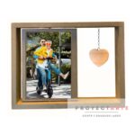 Portarretrato giratorio con corazón colgante